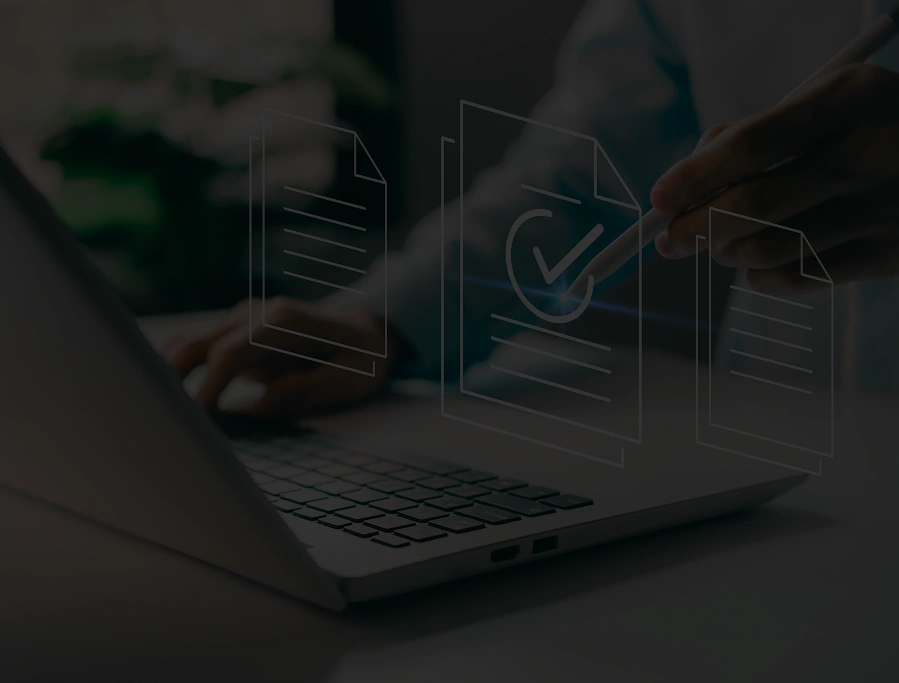 Smiling truck driver sitting in the cab, looking at the camera in warm evening light.